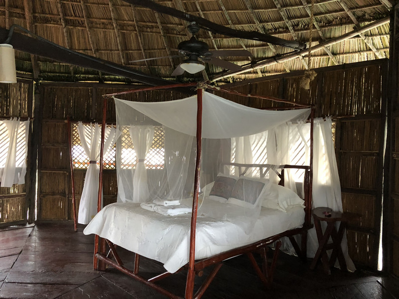the mosquito net covered bed in our bungalow 