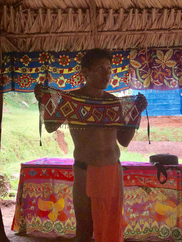 village chief showing the bead skirt work men wear