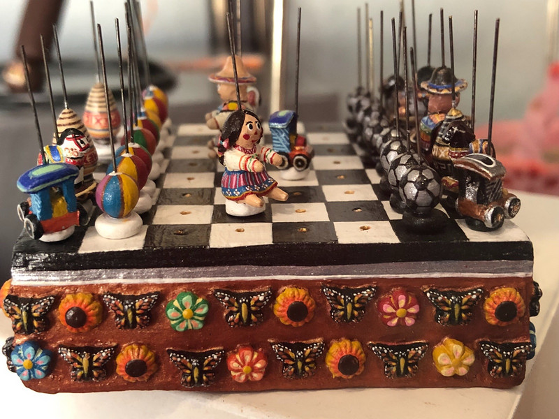 An intricate 2.5 inch square chess set