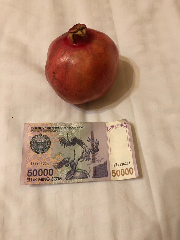 Pomegranate costs 25,000 Som or 50 cents