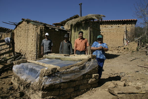 The family with their new toilet and solar shower