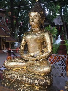 Wat Ket Buddha seeking new gold leaf