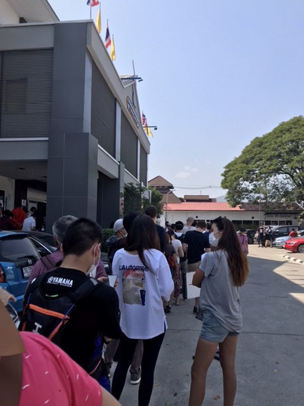 Queuing in the hot sun outside Immigration 