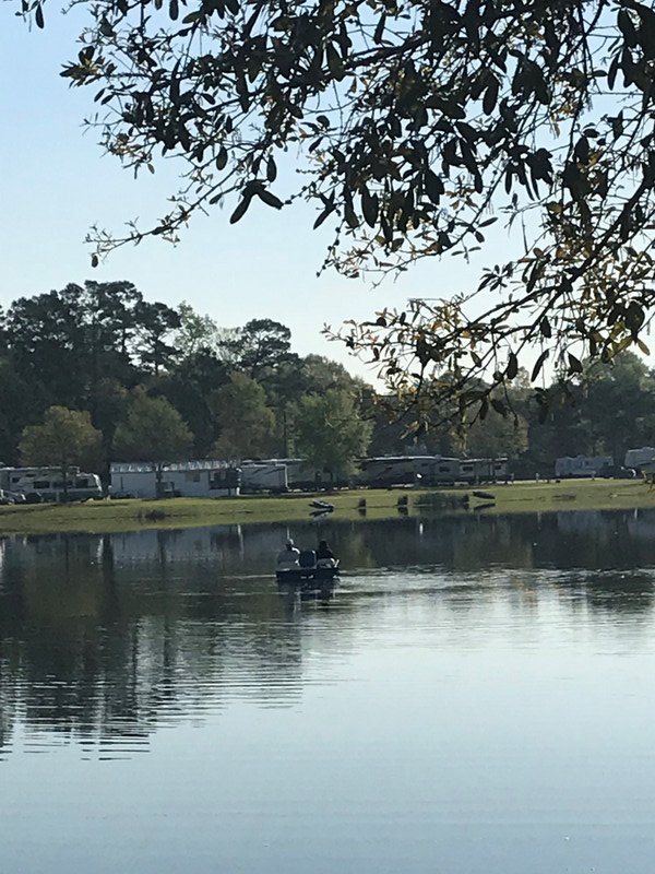 Couple of guys in a paddle boat fishing