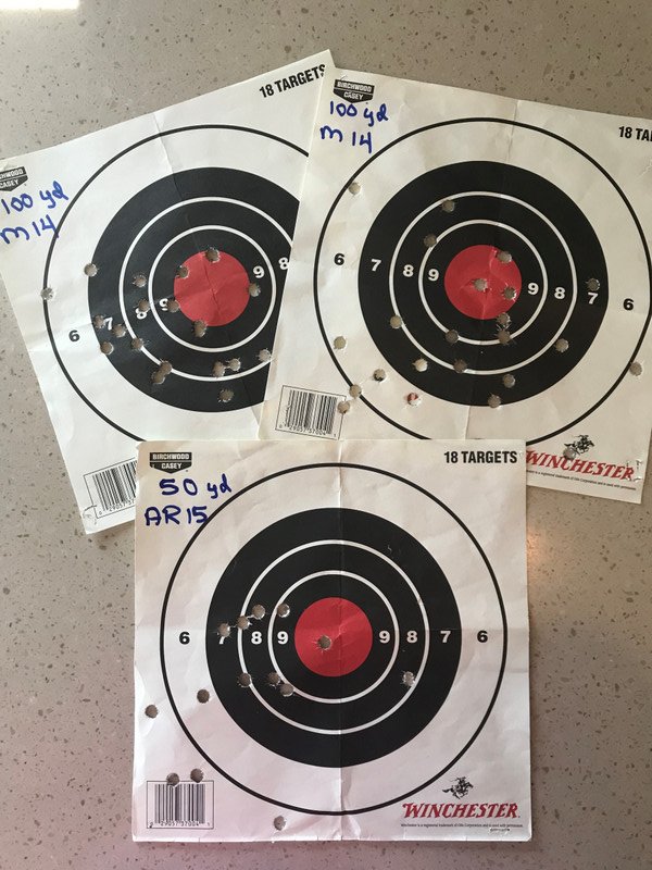top two are shot with M14 from 100 yards; bottom is with AR15 from 50 yards - mark is the only one that got a bull's eye - Man Card Retrieved!