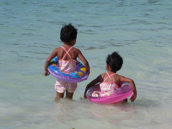Cute sisters on the beach