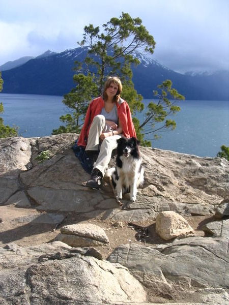 Renata and her dog friend above Lago Puelo