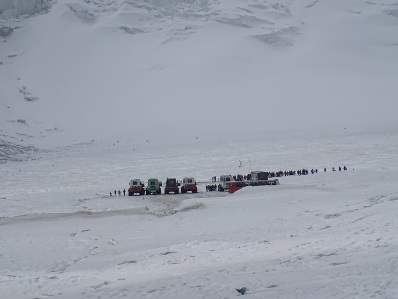 Vehicles and people on the glacier