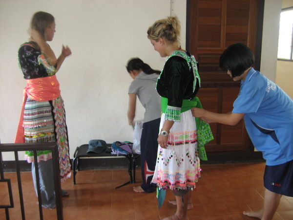 Getting dressed up in the Hmong traditional wear...