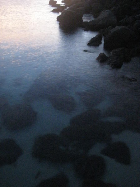 The rocks in the water at moonlight.