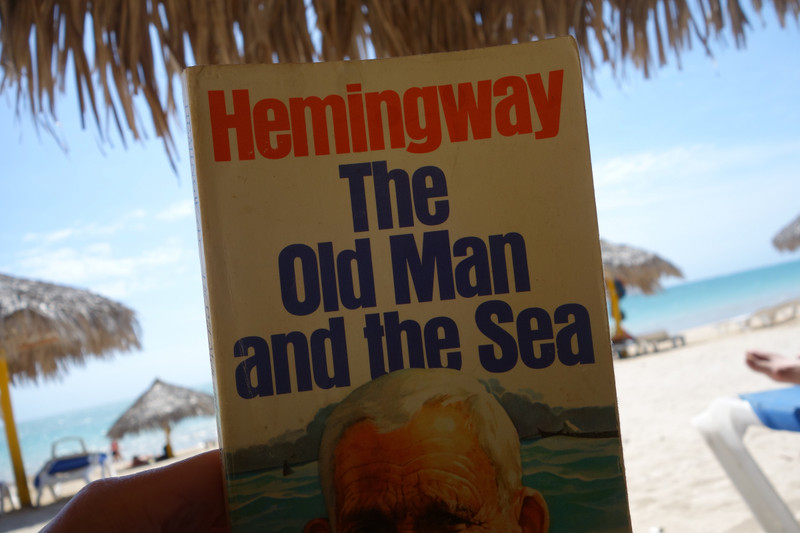 Reading Hemingway on Playa Ancon (Caribbean Sea)
