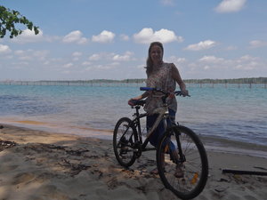 With a bike, on a beach in Malaysia