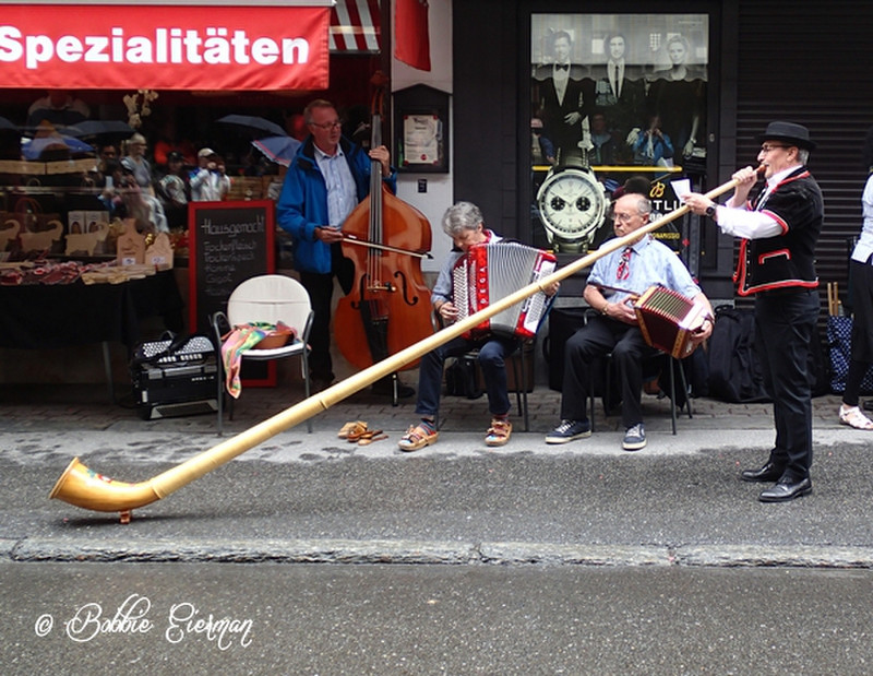 Playing the Alpine horn