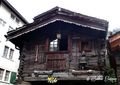 Old Chalet with a collection of item in front