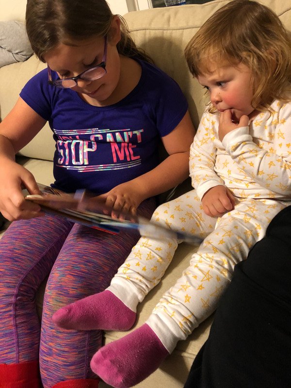 Brooke reading to Rosie