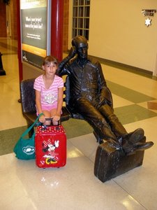 My daughter with a statue of Adlai Stevenson, Bloomington Airport