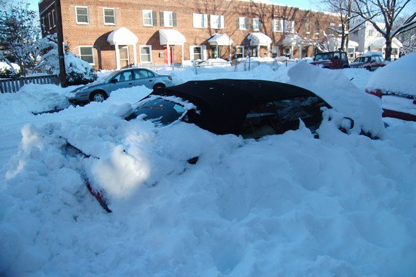 Another buried car - a convertible! They cleaned off their roof