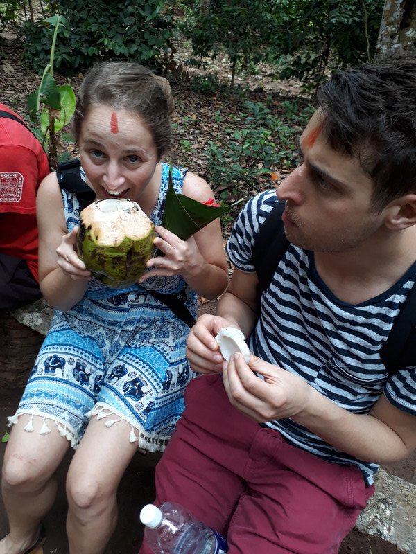 Maya and Tom eating coconuts 