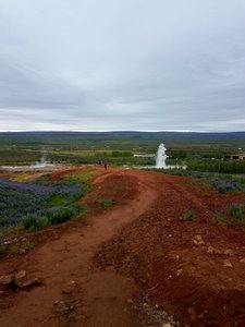 Strokkur erupting in the distance