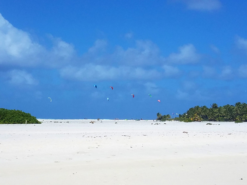 Kite boarders behind the sand bar