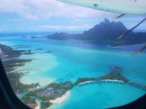 Flying into Bora Bora, over a small village of over-water bungalows