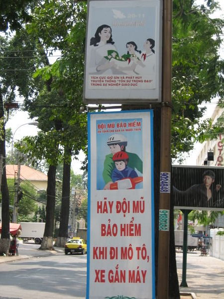 Posters telling everyone that children need a helmet on bikes as well.
