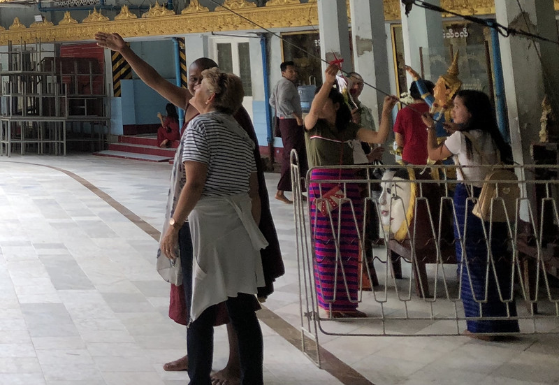monk mugging at Sule Pagoda