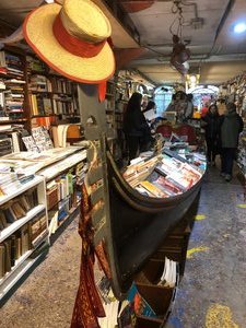 Gondola filled with books- Acqua Alto bookshop Venice