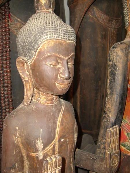 A polished wood Buddha in the Russian Market