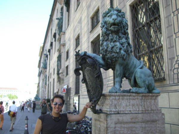 Rubbing the lion for good luck