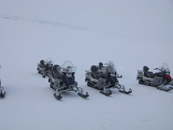Snowmobiles Waiting For Us