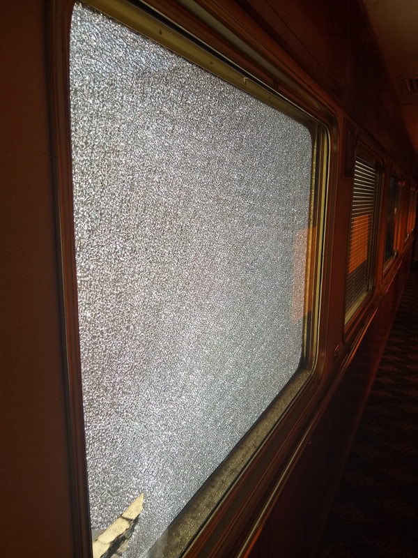 First smashed window in a corridor, 45 minutes into the trip...
