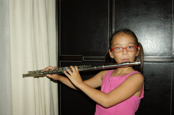 Tiffany, happy with her new flute class at school!