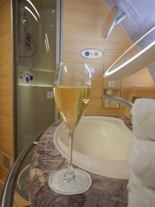 Dom Perignon in the shower at 36,000 feet...could be worst!