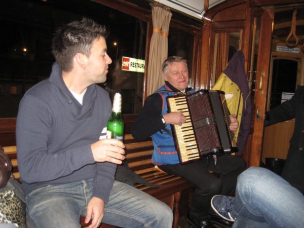And what's a tram party without a piano accordian player?