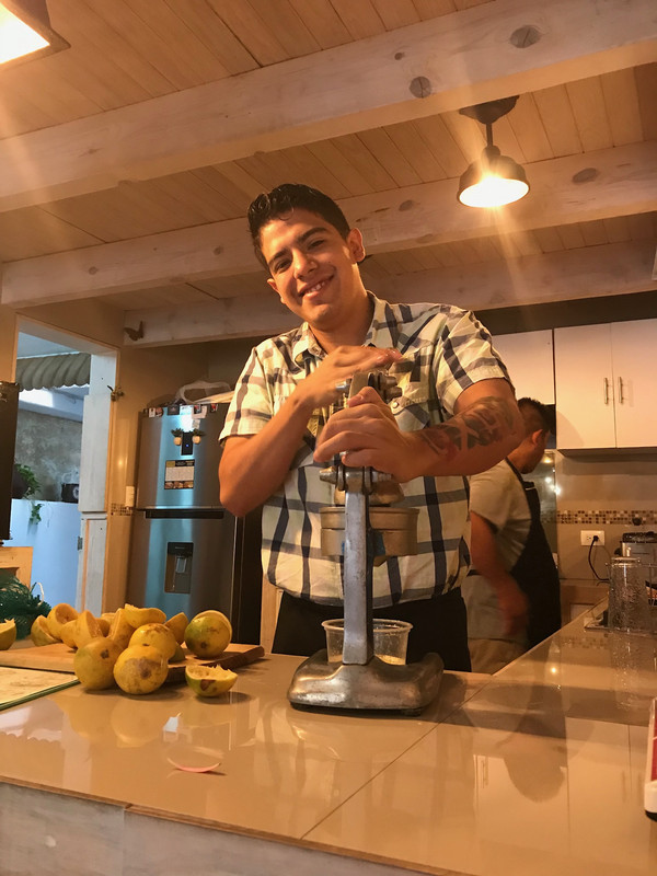 Christian preparing orange juice