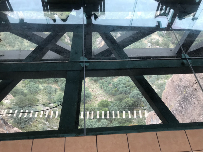 Glass floor reveals rope bridge
