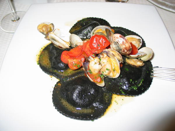 Squid ink ravioli with clams