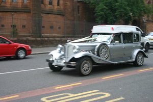 Wedding car leaving Glasgow Cathedral