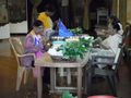 making flower wreaths inside the temple