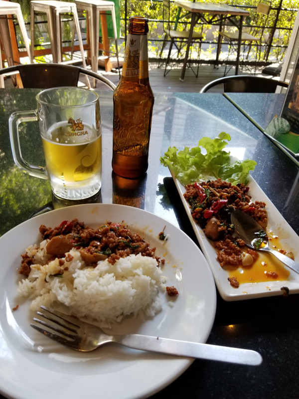 Cold beer and Thai pork with basil