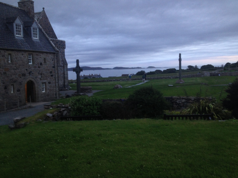 Iona Abbey with 1400 yr old cross standing in front of it