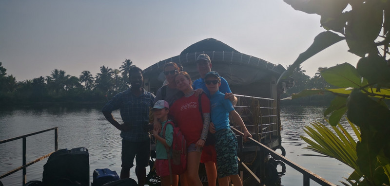 The team with Anoop and our houseboat in the background