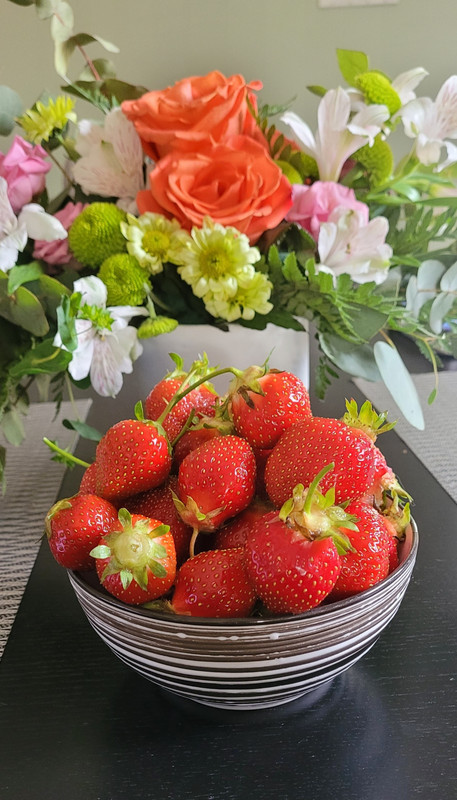 Birthday flowers and strawberries.
