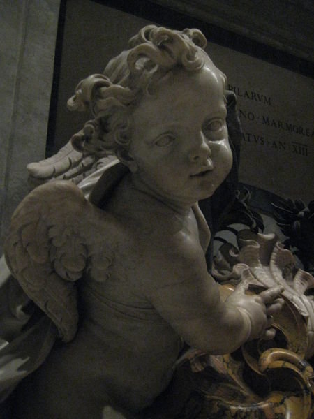 Detail of cherub angel from a Holy water urn