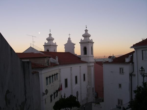 Church tower and view of Tagus in Alfama