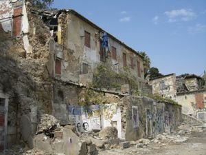 Graffiti and crumbling building near Castelo de Sao Jorge