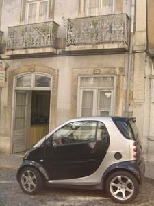 Smart car in front of building