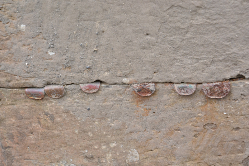 Coins  Between Basalt Blocks