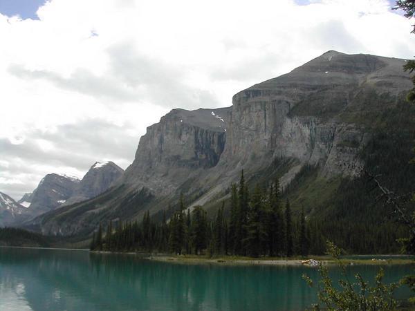A view of the mountains surrounding Maligne Lake.